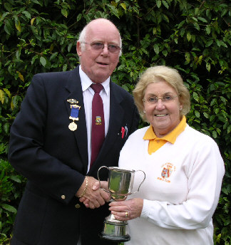 Kath Matthews receives trophy from Captain Rod Payne