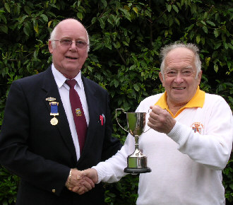 George Chambers receives trophy from Captain Rod Payne