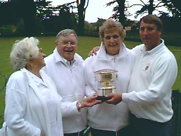 Beryl Borrett presents the trophy to (from left) Derek Taylor, Pauline Scott & Emrys Davies